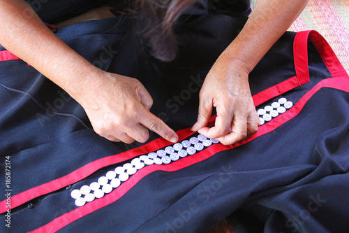 Women are sewing, tribal dress, Phuthai dress photo