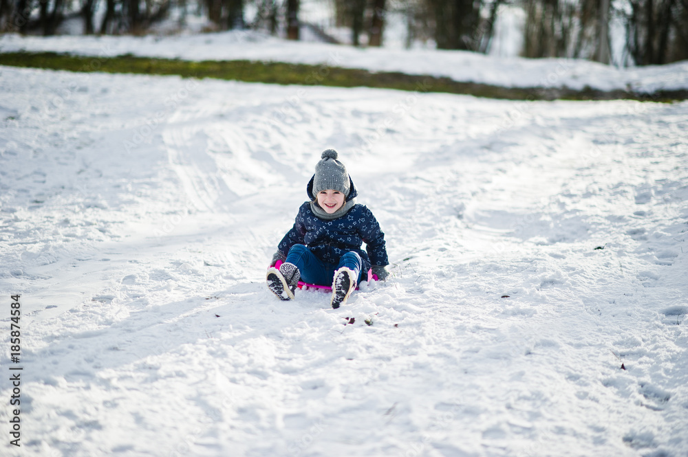 Cute little girl with saucer sleds outdoors on winter day. Cute little girl with saucer sleds outdoors on winter day.