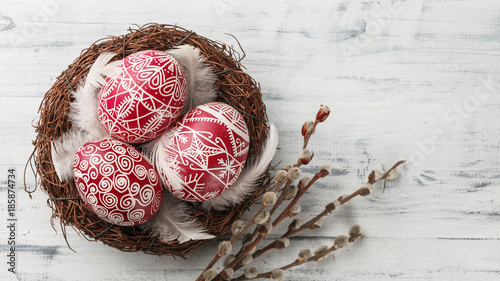 Pysanky, decorated Easter eggs in the nest photo