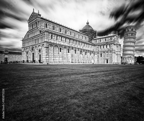 Pisa Cathedral with the Leaning Tower of Pisa on Piazza dei Miracoli in black and white