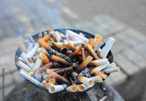 Cigarette butts at ashtray