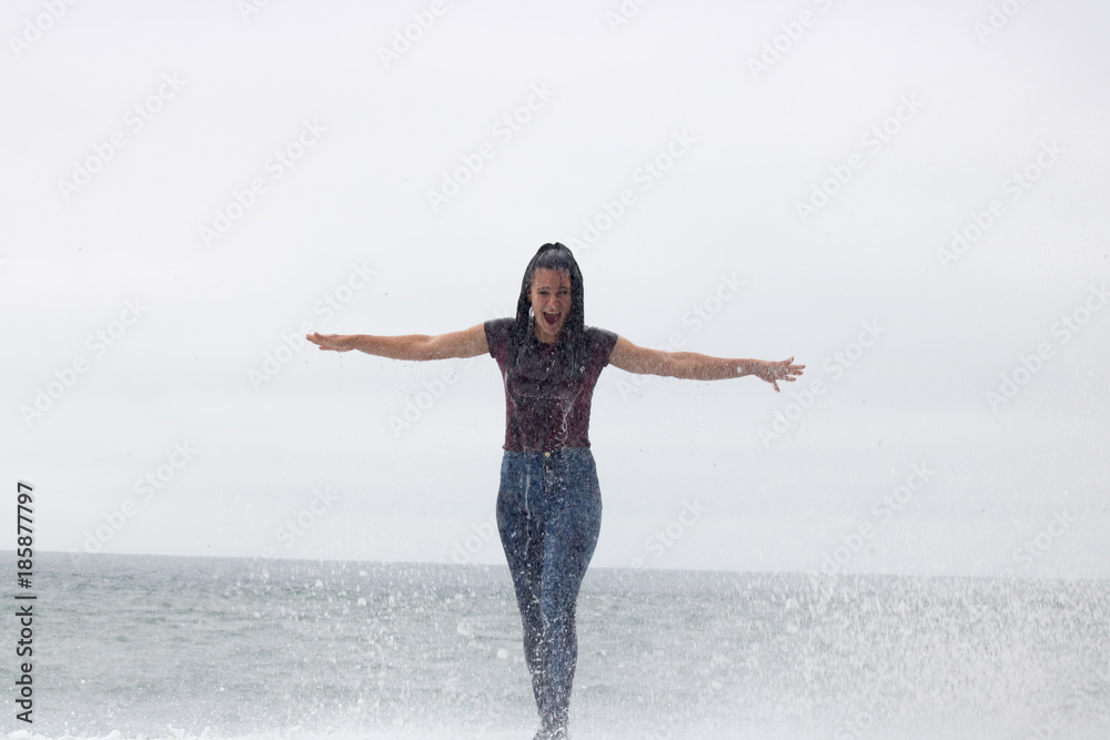 San francisco beach waves water and fun you must visit during your vacation in America teen girl gets wet by the waves San francisco beach waves water and fun you must visit during your vacation in America teen girl gets wet by the waves
