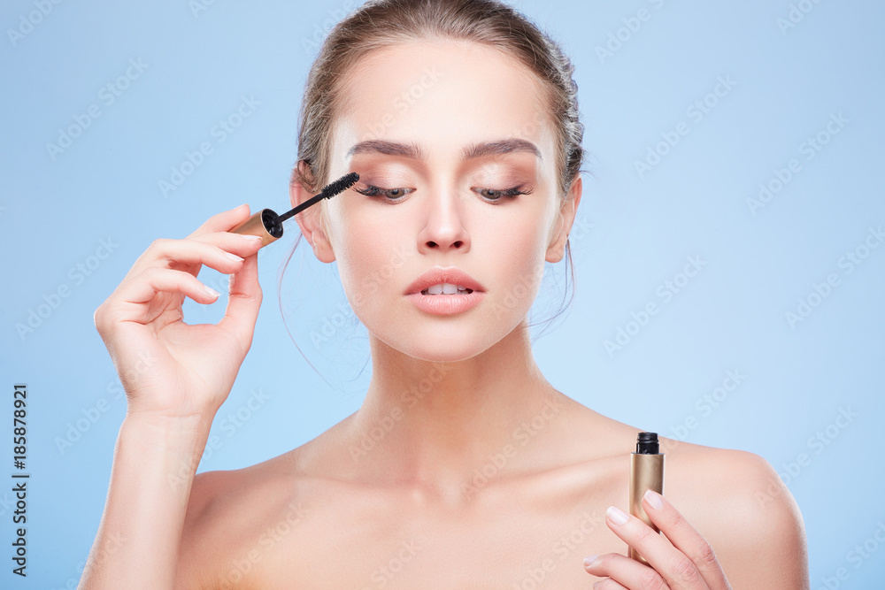 Woman painting lashes