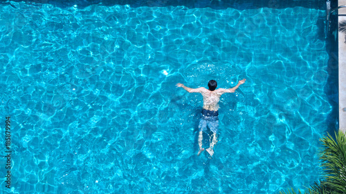 People swimming in the hotel pool on summer day © gnepphoto