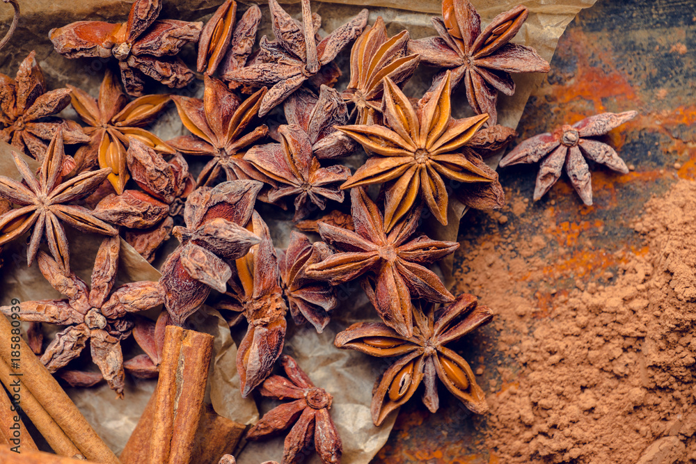 Anise stars on the rustic wooden background. Selective focus. Shallow depth of field.