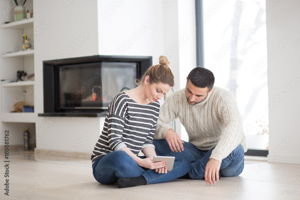 Young Couple using digital tablet on cold winter day Young Couple using digital tablet on cold winter day
