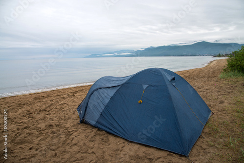 Tourist tent on the shore of Lake Baikal  Cloudy weather after rain.