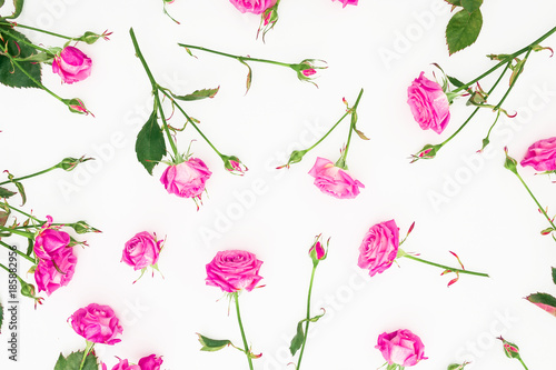 Floral pattern with pink flowers on white background. Flat lay, Top view. Roses flower texture