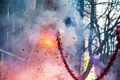 Firecrackers exploding in the street for the chinese new year celebration photo