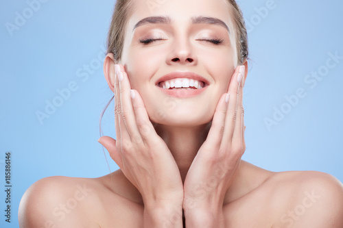 Beauty portrait of happy woman with closed eyes photo