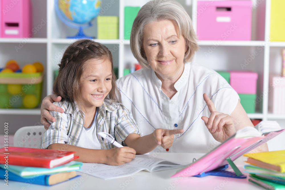 granny with grandchildren doing homework granny with grandchildren doing homework