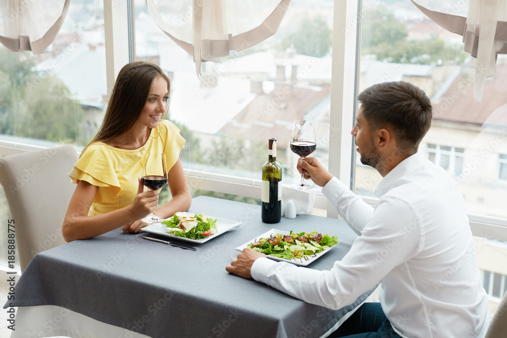 Beautiful Couple In Love On Romantic Date In Restaurant. Beautiful Couple In Love On Romantic Date In Restaurant.