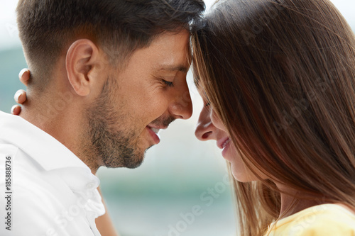 Young Couple In Love Enjoying Each Other Outdoors.