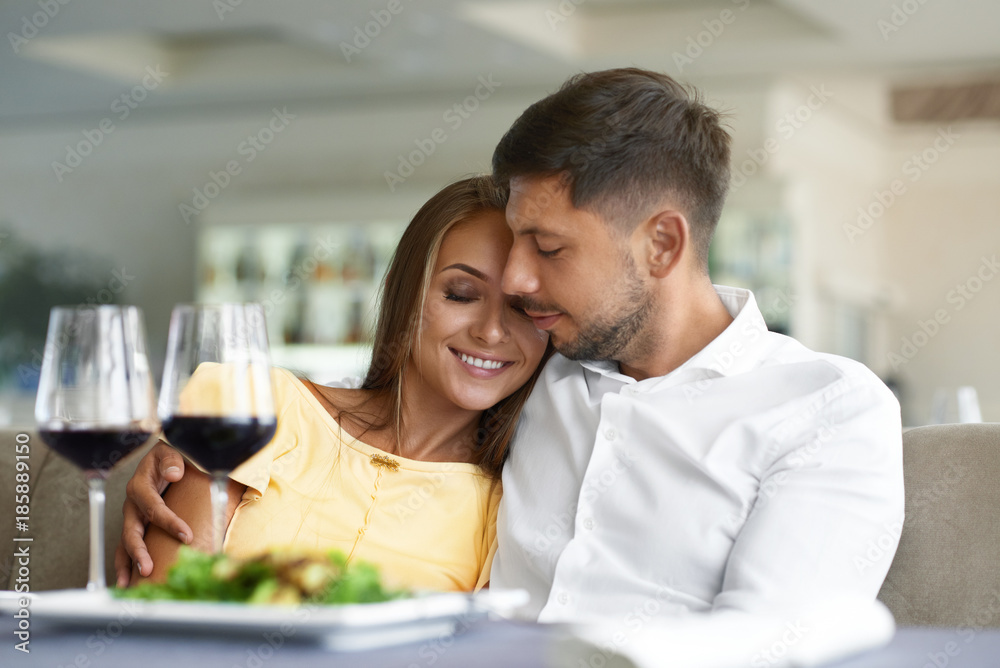 Couple In Love Drinking Wine In Restaurant. Couple In Love Drinking Wine In Restaurant.