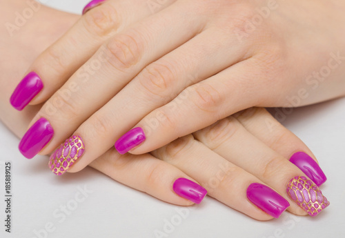 beautiful female hands with pink nail polish on a white background  spa treatments