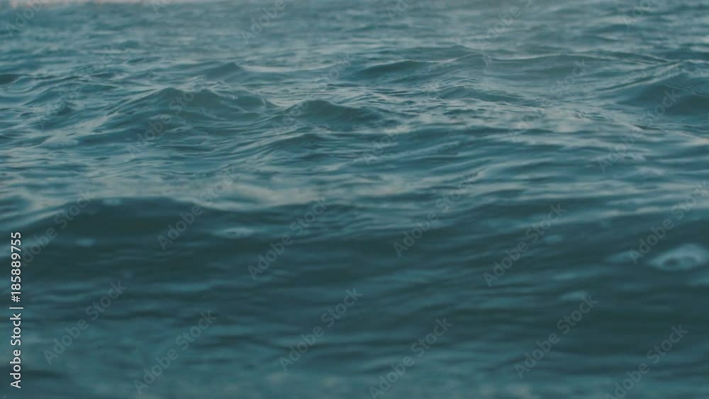 Slow motion video of sea water surface. Dackground for movie credits or intro Slow motion video of sea water surface. Dackground for movie credits or intro