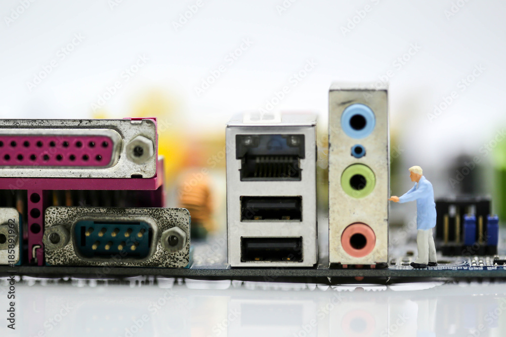 Fototapeta premium Miniature people : engineer and worker working on computer mainboard bitcoin concept.