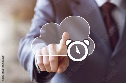 Businessman presses button cloud clock online time