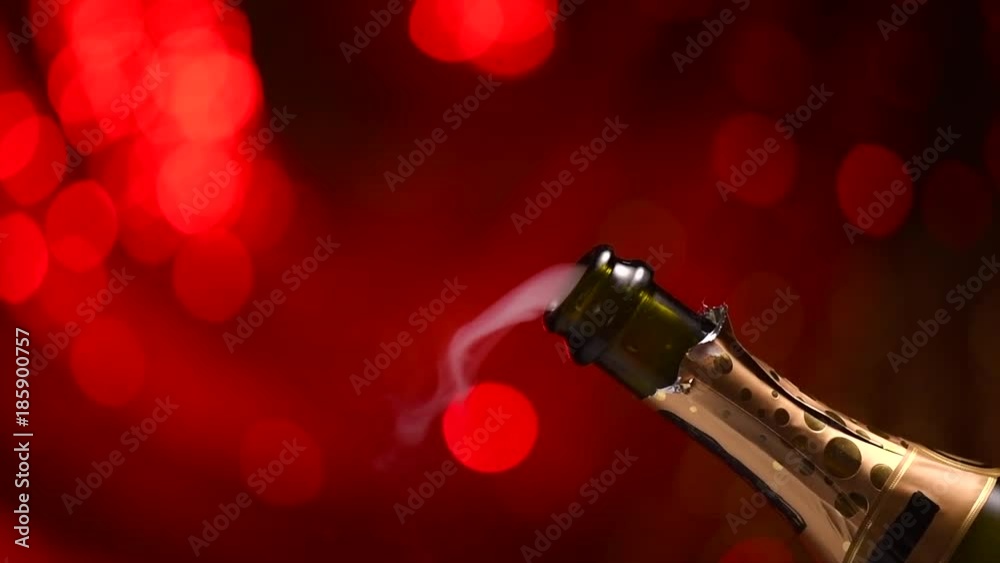 Champagne explosion. Sparkling wine popping, opening champagne bottle closeup. Slow motion. 4K UHD video footage. 3840X2160
