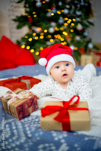 Baby in a christmas hat © Nichizhenova Elena