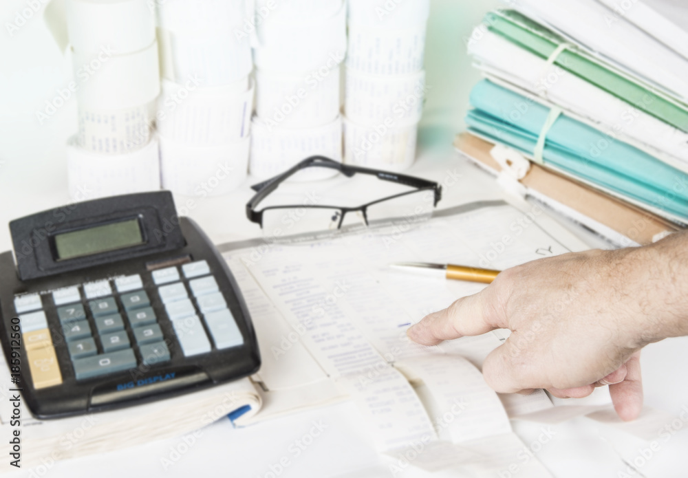 Fototapeta premium Bookkeeping files and tools with eyeglasses. Audit concept.