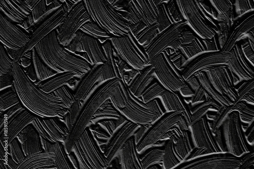 The background is black with the texture of the plaster. Surface of the wall with a pattern of strips. photo