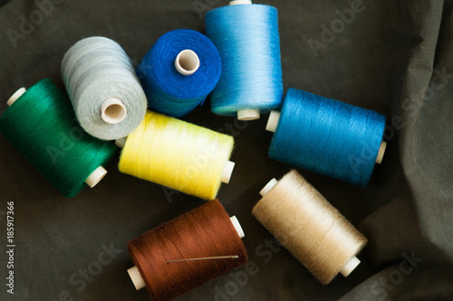Pile of colorful spools of thread 