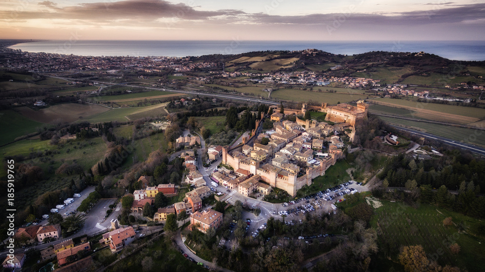 Italia, Gradara dicembre 2017 - Vista aerea del borgo medievale di Gradara in provincia di pesaro. Sullo sfondo la riviera romagnola