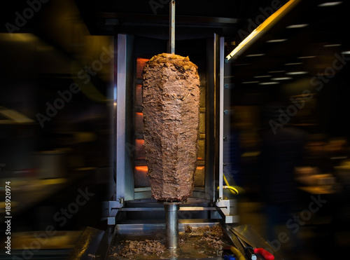 traditional turkish food doner kebab in a street food shop on blur background photo