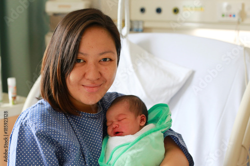 Mother holding her newborn child after labor