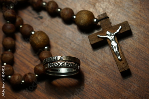 wooden rosary and ring close up