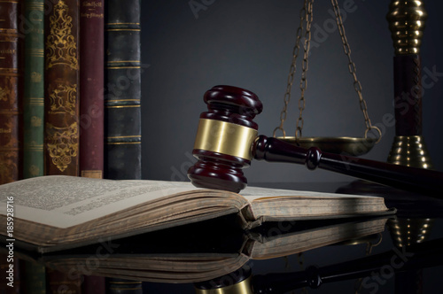  law theme, mallet of the judge, justice scale, old books, wooden desk photo