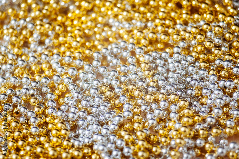 Silver and gold beads. Texture, background. Silver and gold beads. Texture, background.