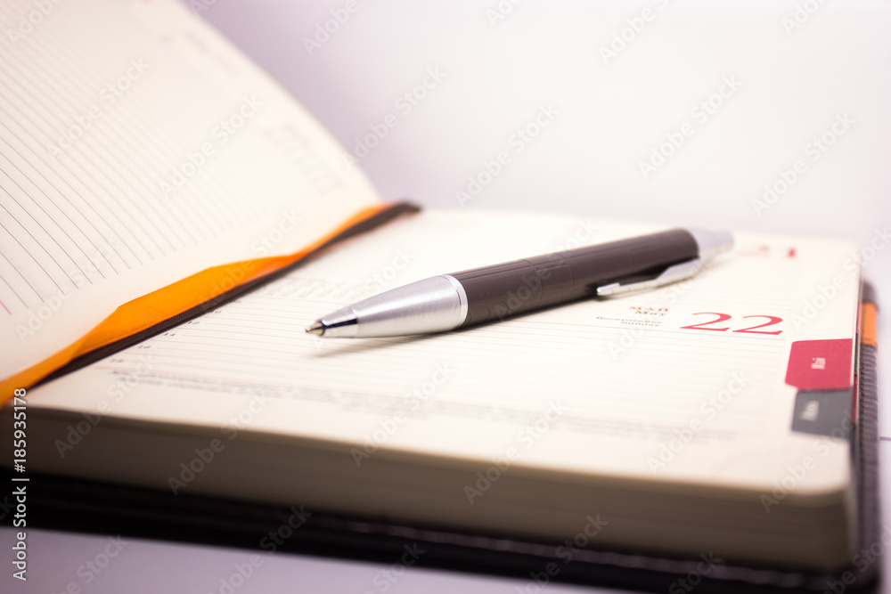 pen on a diary close up pen on a diary close up
