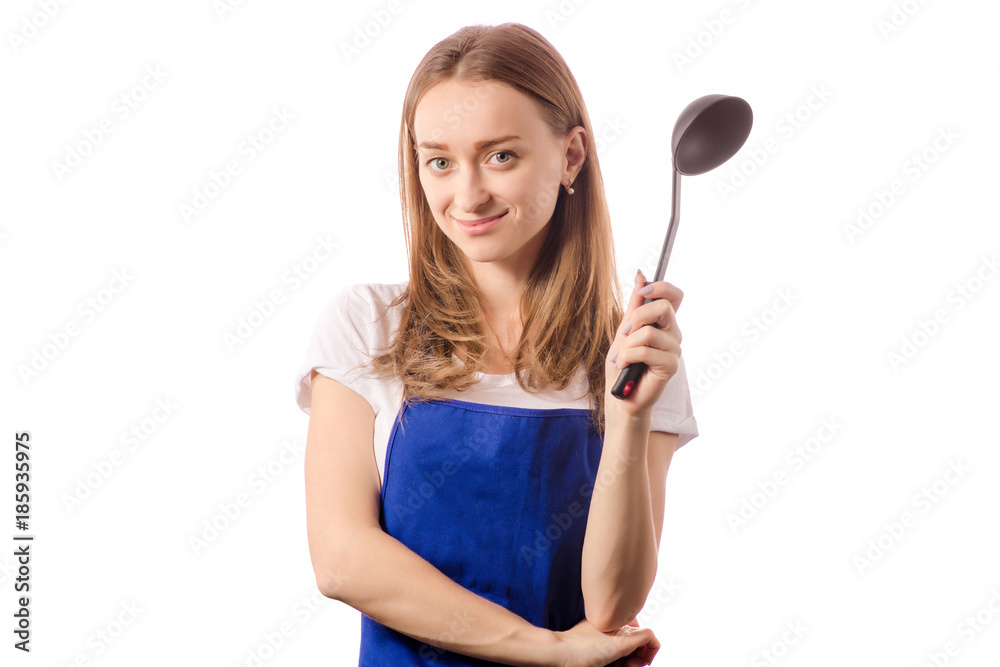 Young woman in apron holding kitchen scoop Young woman in apron holding kitchen scoop