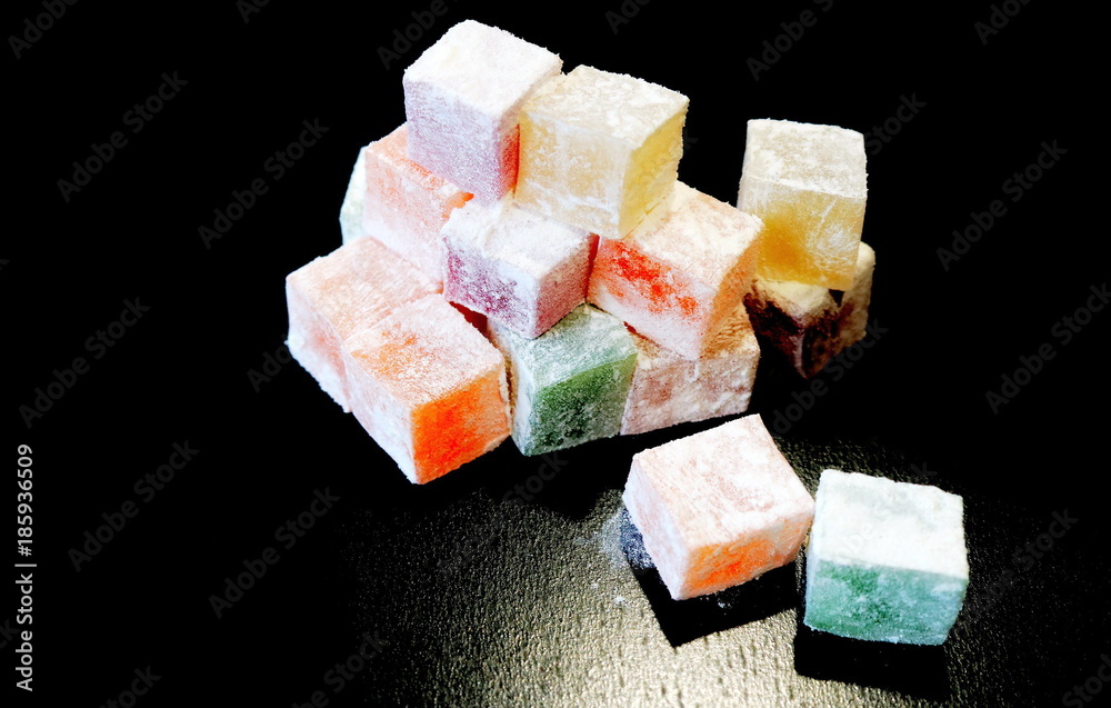 Turkish Delight. Turkish sweets. Eastern sweets. Fruit cubes of rahat-lukum in powdered sugar.