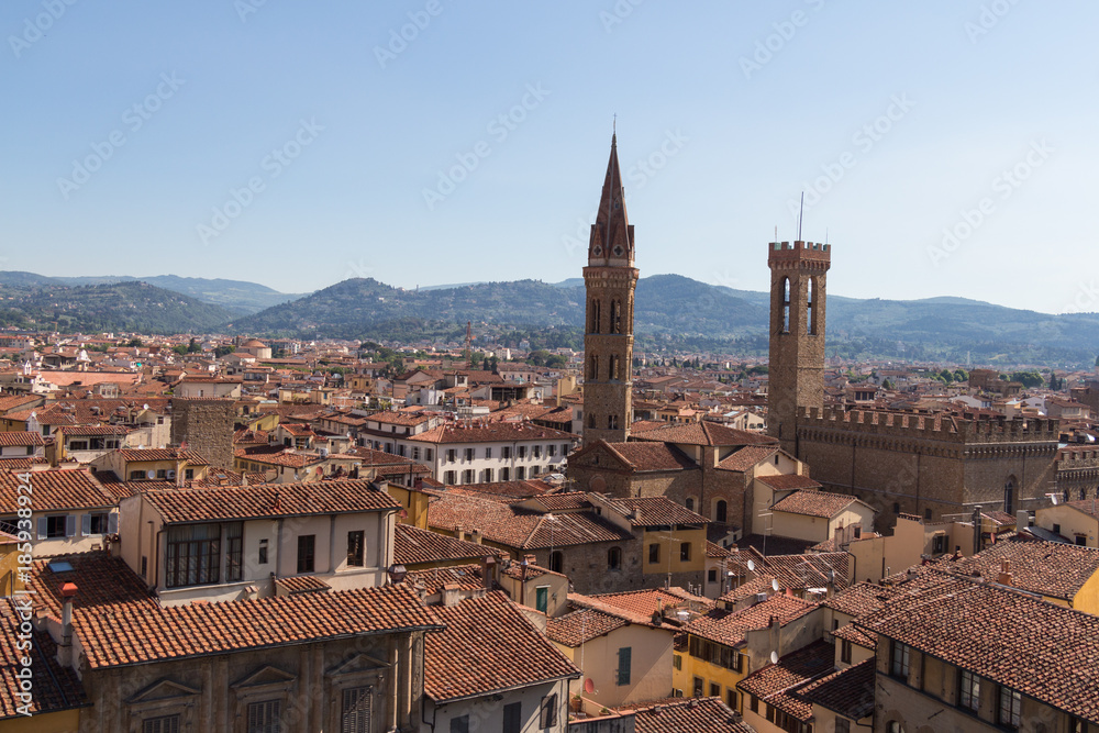 Red roofs of Florence from Palazzo Vecchio in a sunny day, Tuscany, Italy.