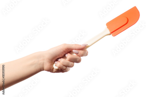 Kitchen silicone spatula in hands