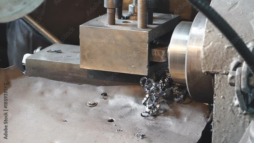 Professional machinist. Horizontal shot of a man operating lathe grinding machine metalworking industry concept copyspace