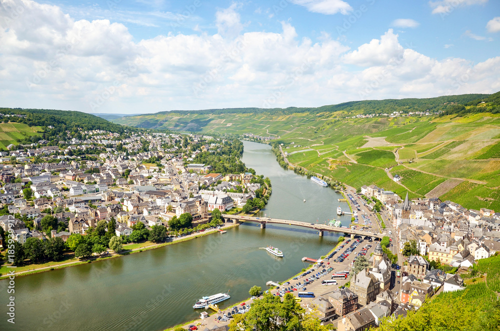 Moselle Valley Germany: View from Landshut Castle to the old town Bernkastel-Kues with vineyards and river Mosel in summer, Europe