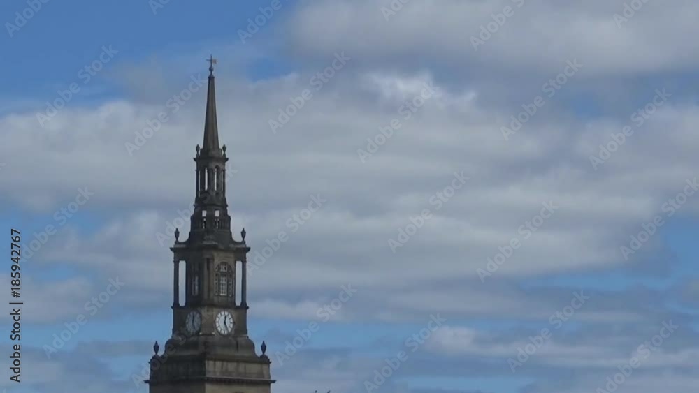 1. Tower with clock- a beautiful view on a blue, slightly cloudy sky and an ancient tower with clock, Newcastle upon Tyne, UK 1. Tower with clock- a beautiful view on a blue, slightly cloudy sky and an ancient tower with clock, Newcastle upon Tyne, UK