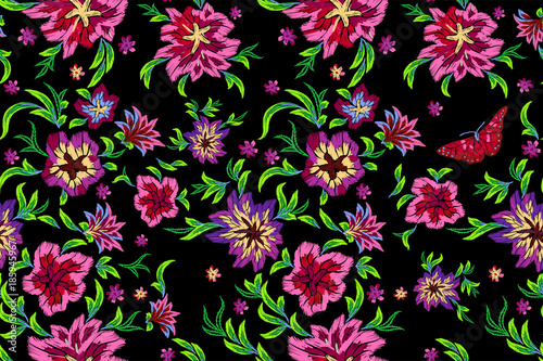 Embroidery bright seamless pattern with flowers and butterflies. Vector embroidered floral design for fashion wearing. © lxby60
