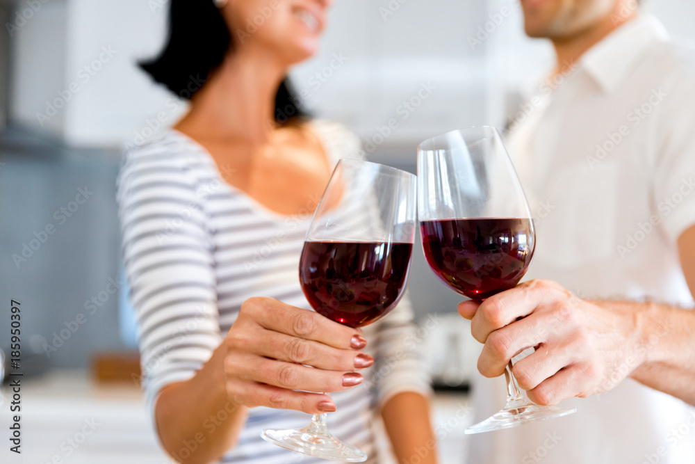 Portrait of a couple having a glass of red wine