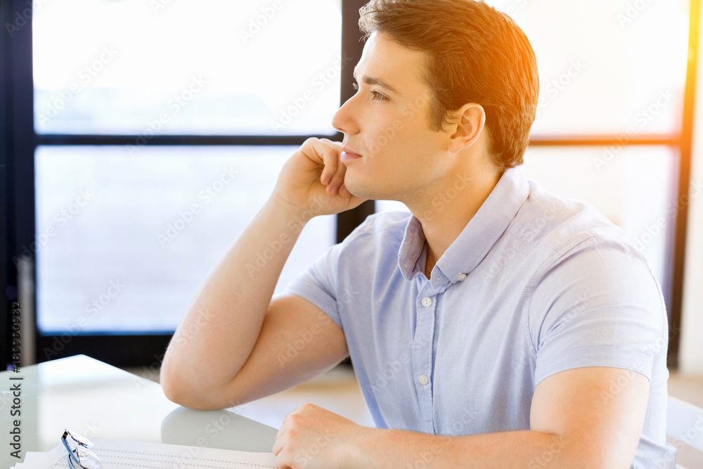 Pensive businessman at office