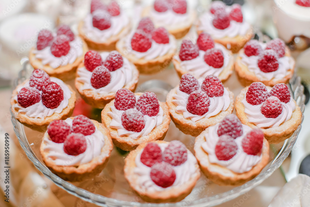 Raspberry cupcake desserts with pink cream
Raspberry cupcake desserts with pink cream