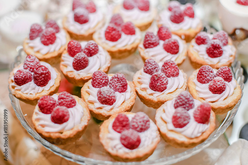 Raspberry cupcake desserts with pink cream
