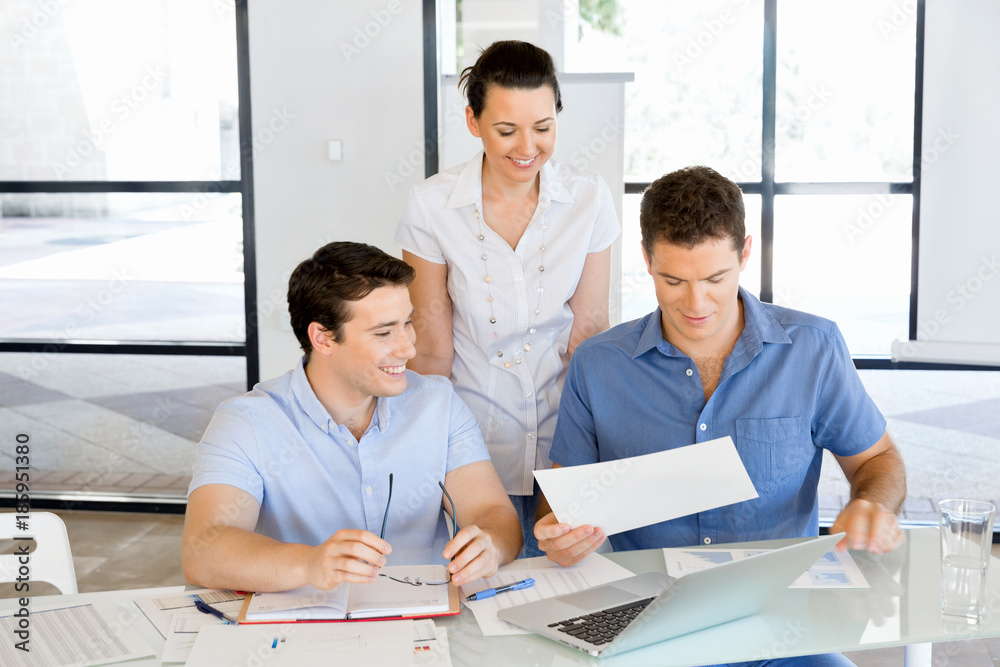 Group of happy young business people in a meeting