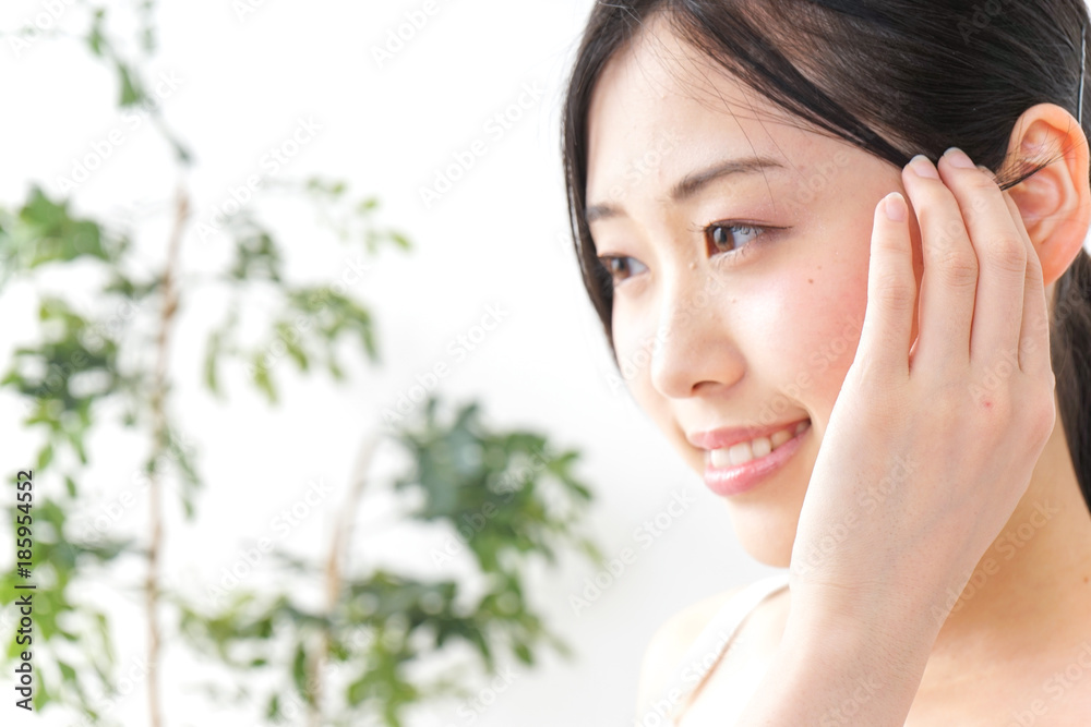 Young woman taking care of face Young woman taking care of face