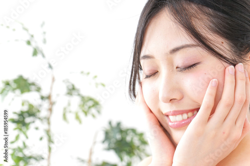 Young woman taking care of face