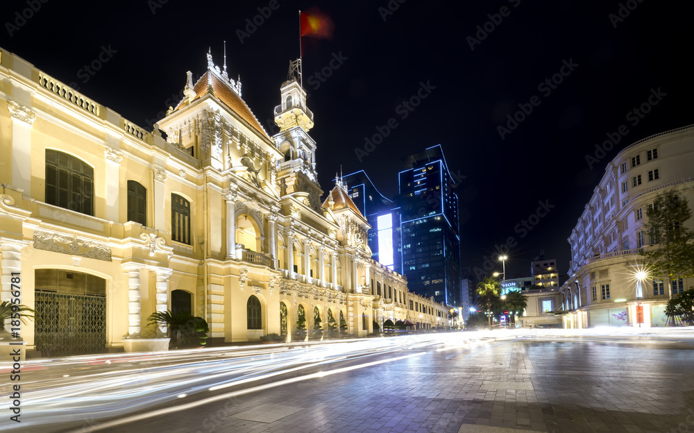 Naklejka premium Ho Chi Minh City, Vietnam - December 21st, 2017: Architecture palace royal night, formerly property of French later People's Committees of attracting tourists sightseeing in Ho Chi Minh, Vietnam